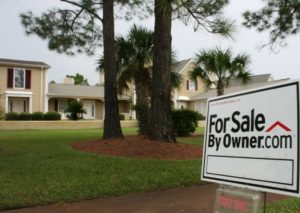 House with For Sale sign 